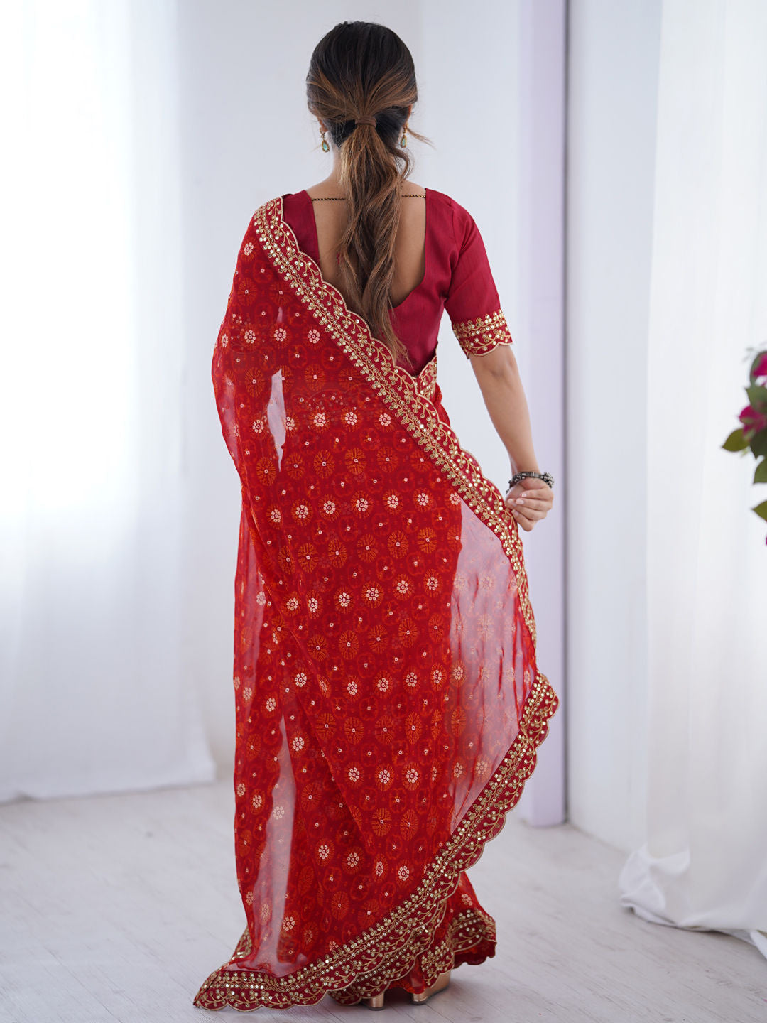 Georgette Party Wear Saree
in Red and Maroon with Printed work